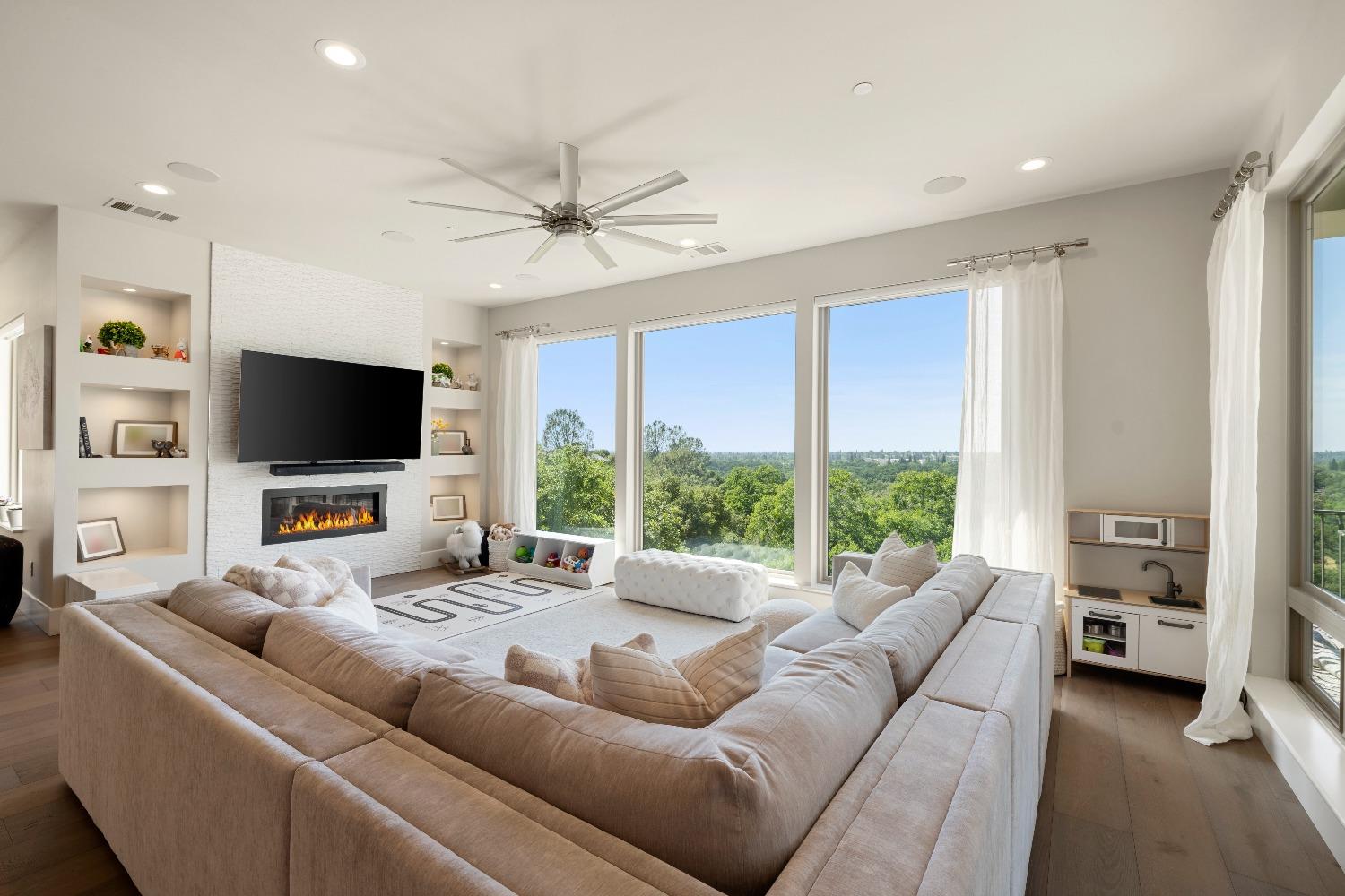 4023 Cornwall Court Rocklin, CA 95677 - Photo 29 of 85 a living room with furniture a flat screen tv and a large window