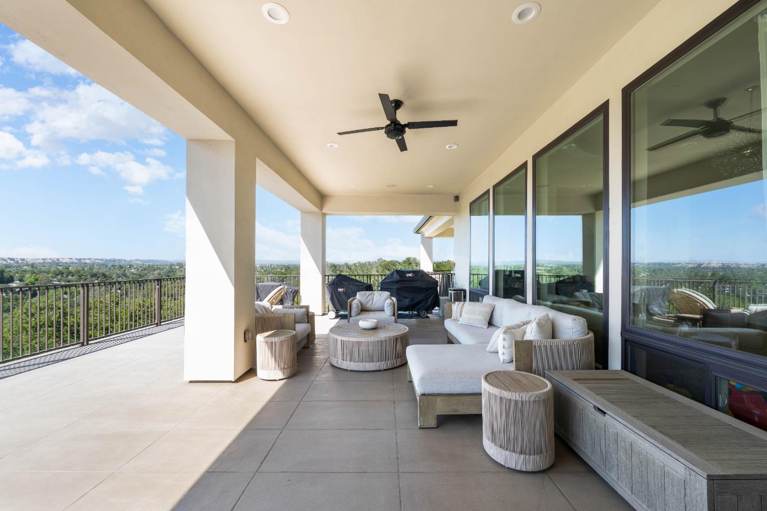 4023 Cornwall Court Rocklin, CA 95677 - Photo 40 of 85 a living room with furniture and a floor to ceiling window