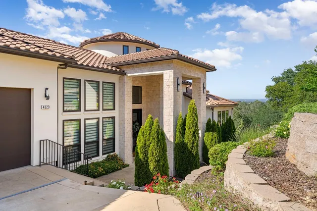 a view of a house with a garden