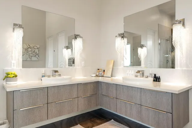 a living room with furniture and large windows