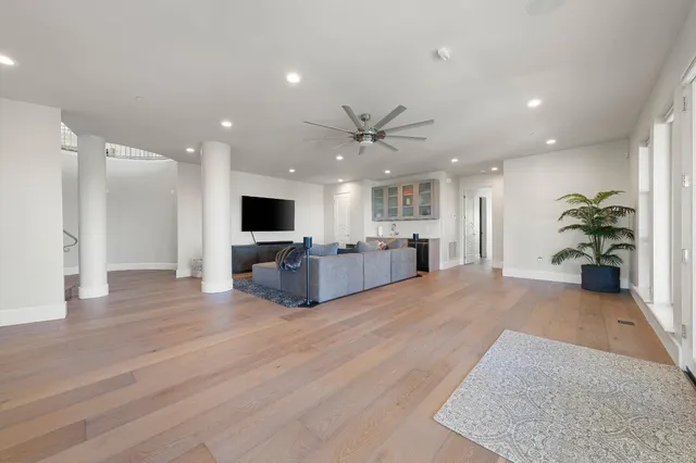 an aerial view of a house with a yard