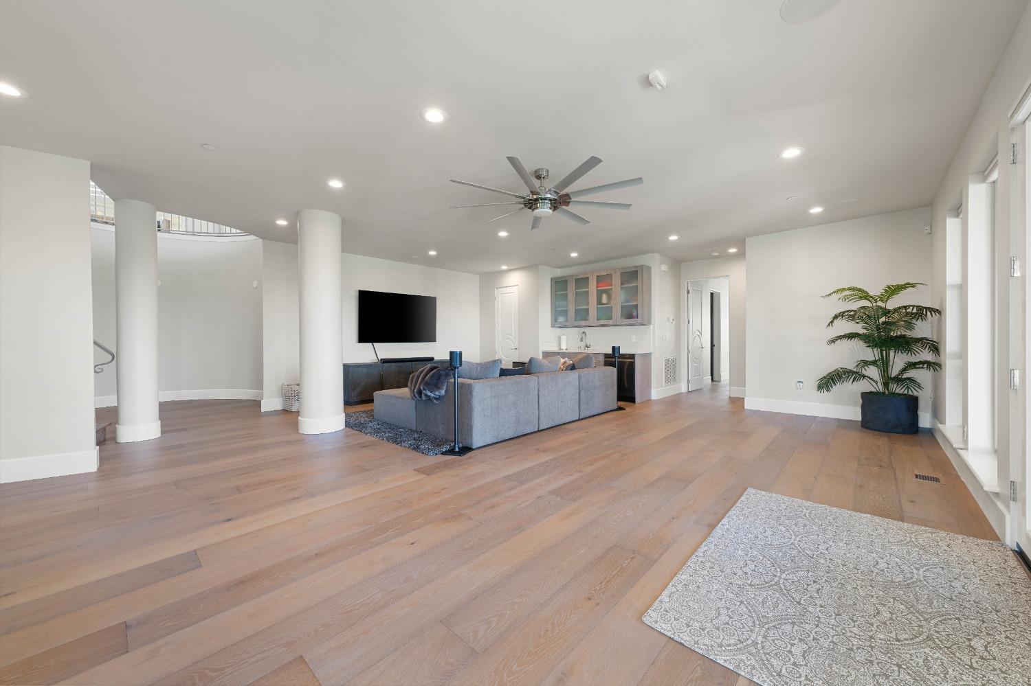 4023 Cornwall Court Rocklin, CA 95677 - Photo 50 of 85 a view of a livingroom with a flat screen tv and kitchen view