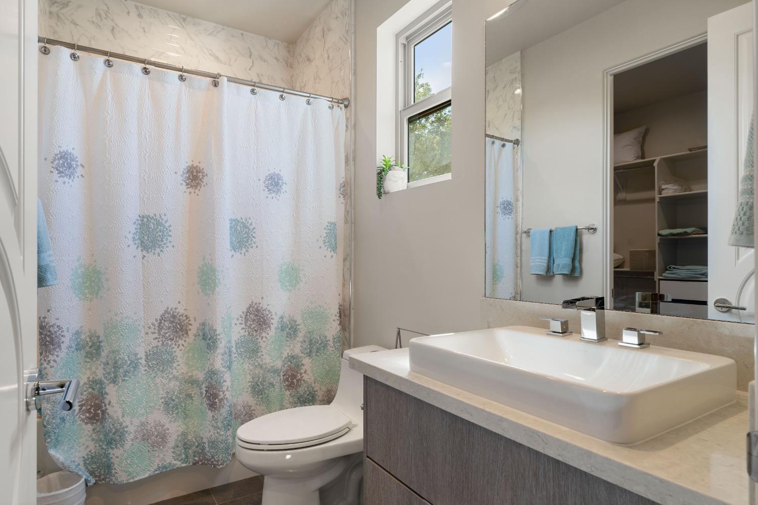 4023 Cornwall Court Rocklin, CA 95677 - Photo 58 of 85 a bathroom with a sink toilet and shower