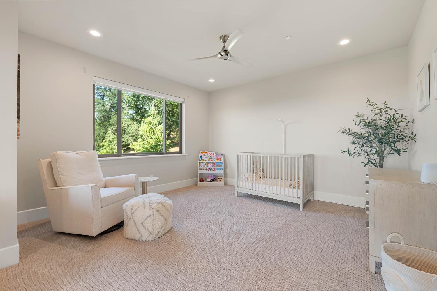 4023 Cornwall Court Rocklin, CA 95677 - Photo 62 of 85 a spacious bedroom with a bed and a chandelier