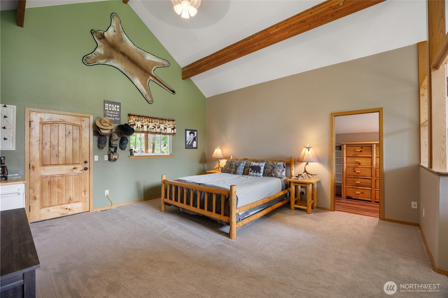 11125 Entiat River Road Entiat, WA 98822 - Photo 25 of 40 a bed room with a bed and a chandelier