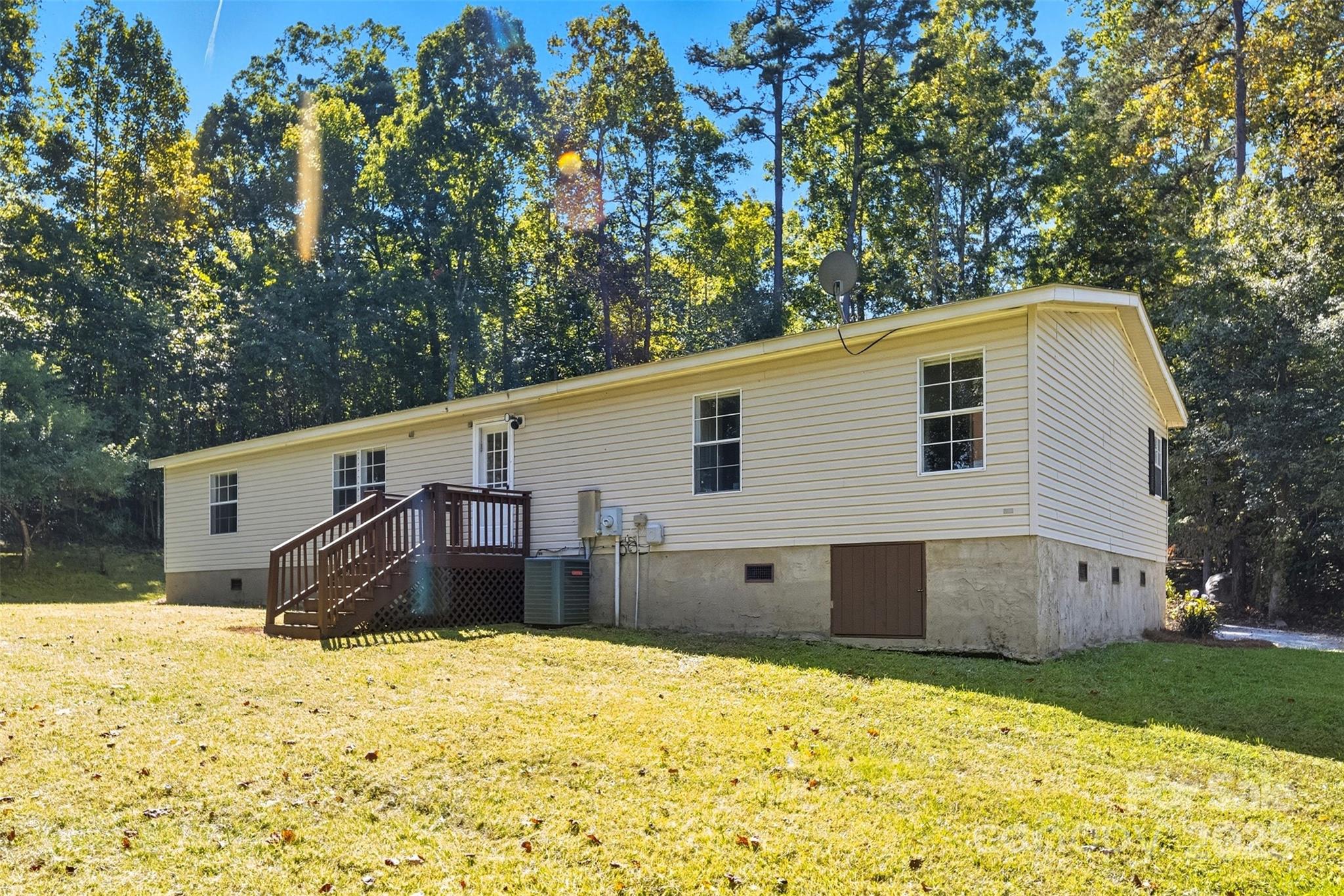 2319 Alexis Lucia Road Stanley, NC 28164 - Photo 23 of 32 a view of a house with a yard