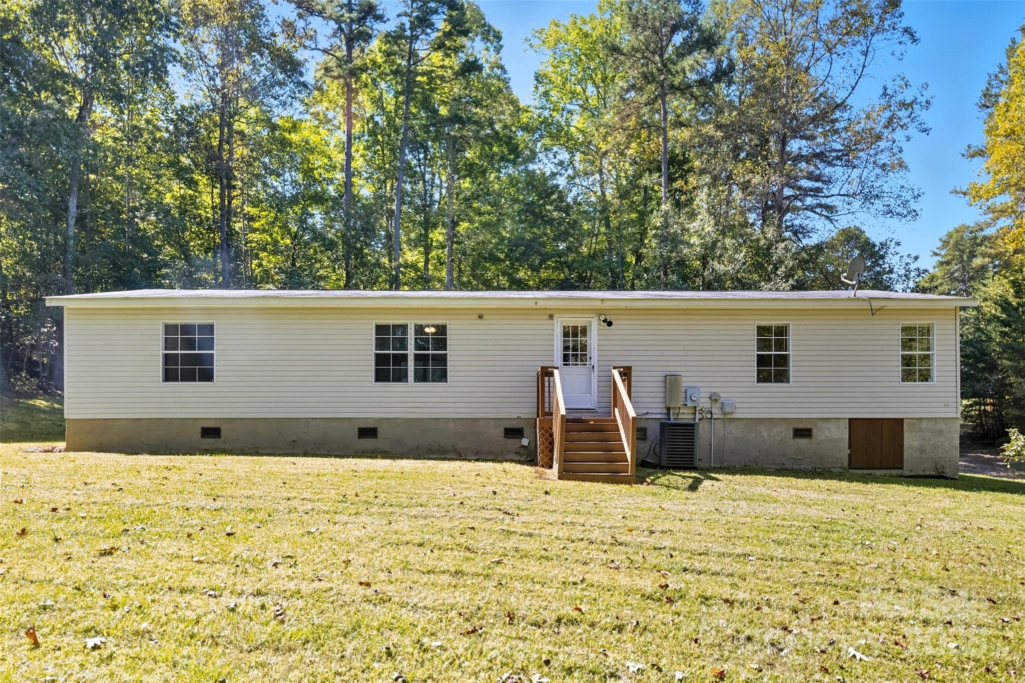 2319 Alexis Lucia Road Stanley, NC 28164 - Photo 24 of 32 a view of a house with a backyard