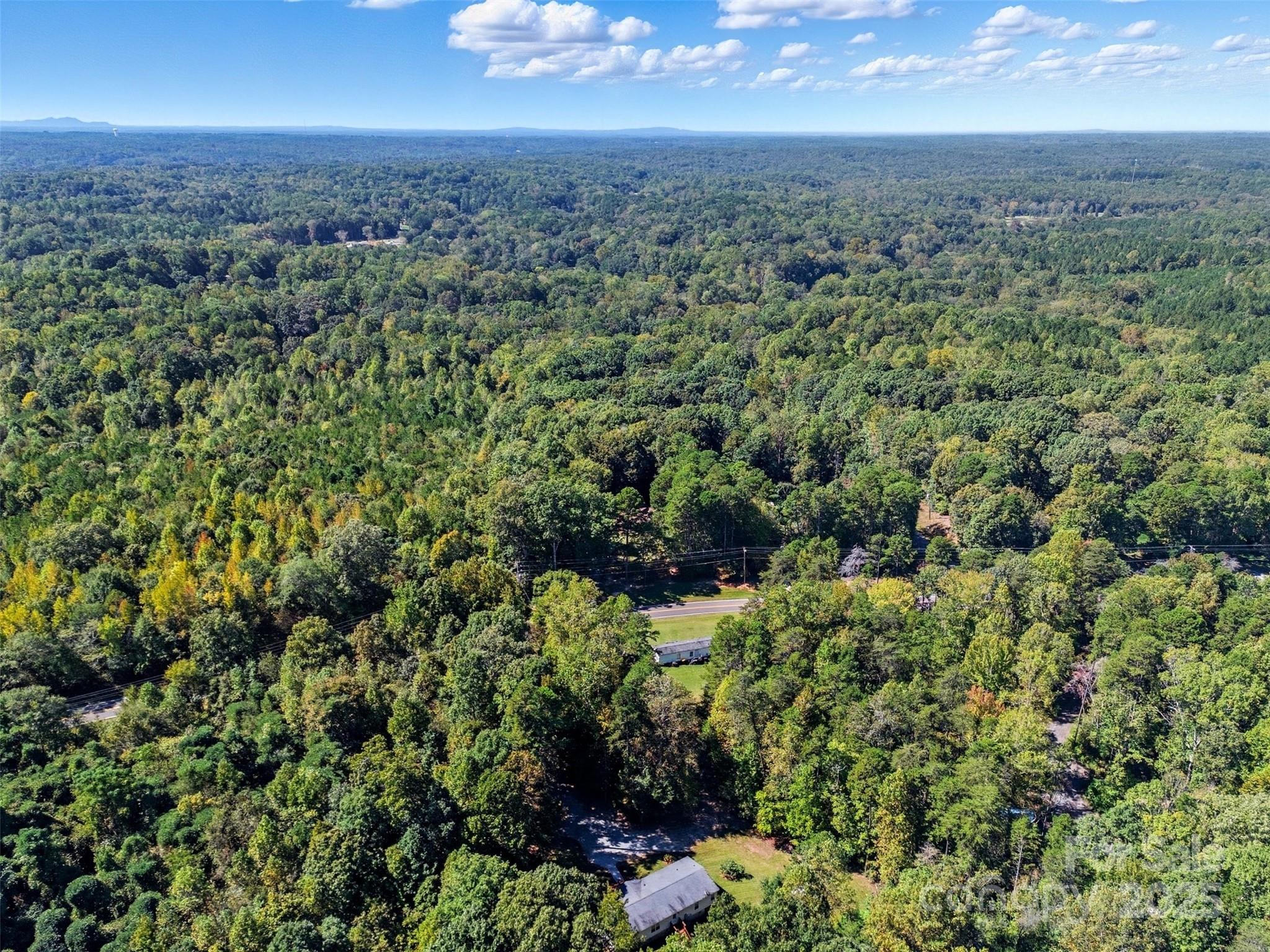 2319 Alexis Lucia Road Stanley, NC 28164 - Photo 29 of 32 an aerial view of residential houses with outdoor and green space