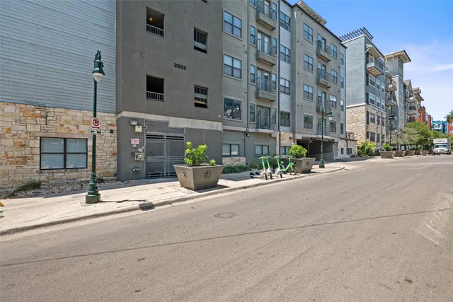 a view of a building with a street