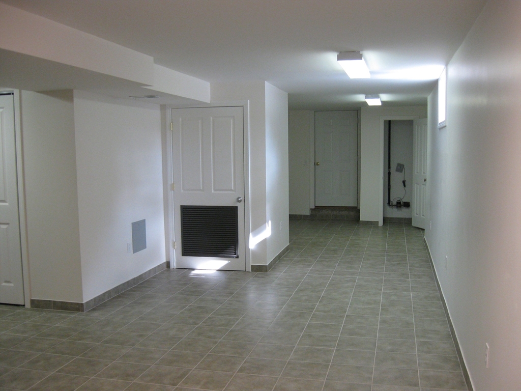 2856 Washington Street Boston, MA 02119 - Photo 22 of 39 a view of a livingroom with a fireplace