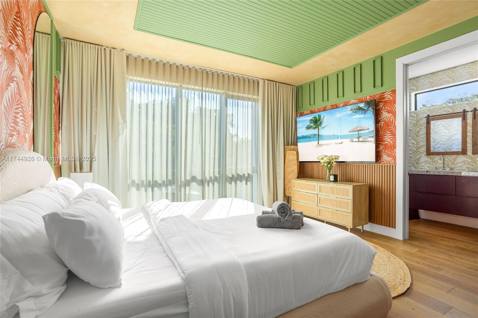 416 Northwest 52nd Street Miami, FL 33127 - Photo 11 of 70 a bedroom with a bed and a large window