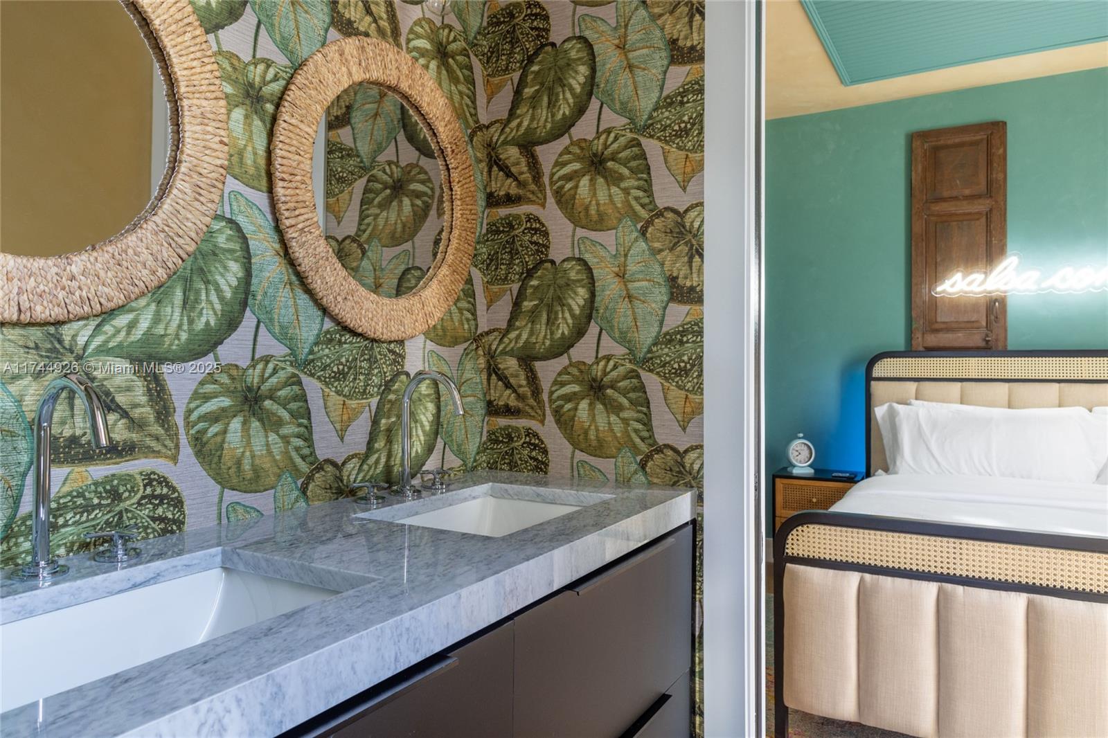 416 Northwest 52nd Street Miami, FL 33127 - Photo 24 of 70 a view of a bathroom with a sink and mirror
