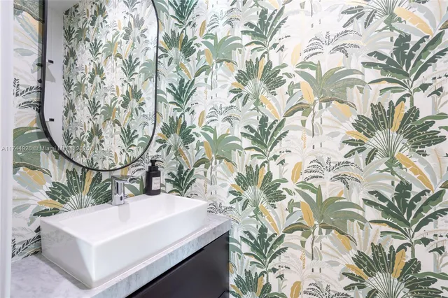 an outdoor sitting area with furniture and garden