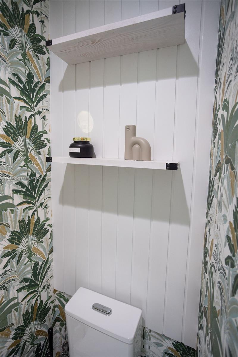 416 Northwest 52nd Street Miami, FL 33127 - Photo 30 of 70 a bathroom with a toilet and sink