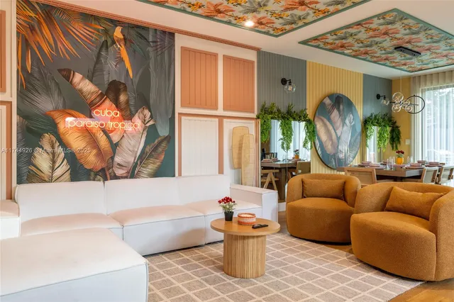 a room with furniture and painting on the wall