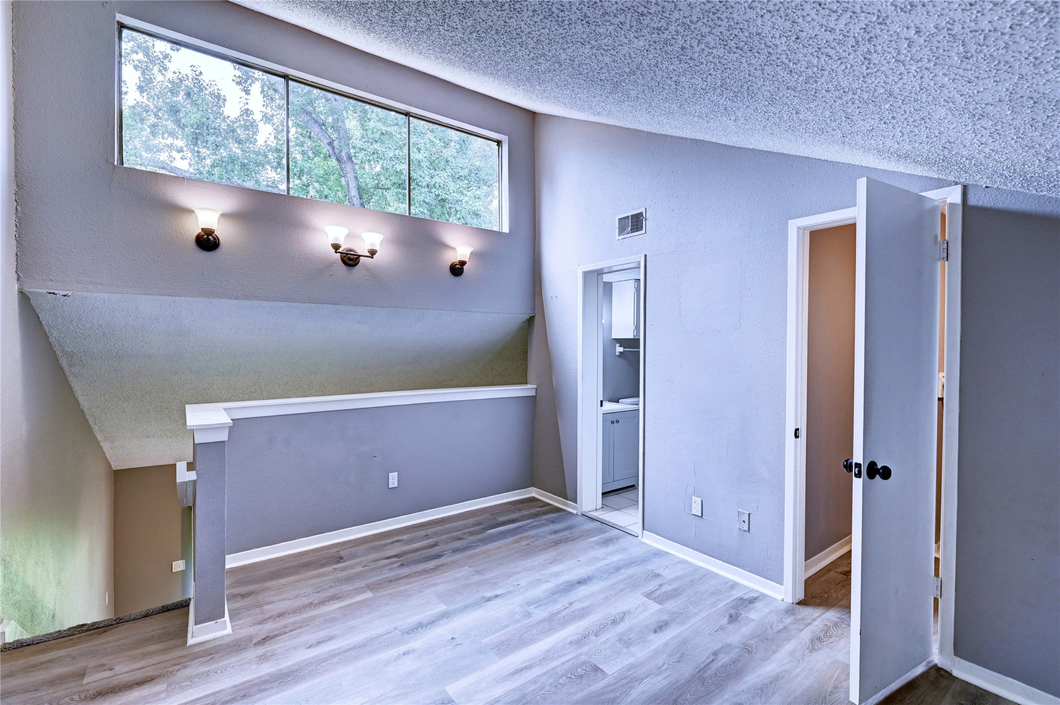 12900 Walden Road, Unit 6 Montgomery, TX 77356 - Photo 25 of 39 Lots of natural lighting and a nice view of nature.