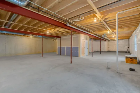 a view of empty room with wooden ceiling