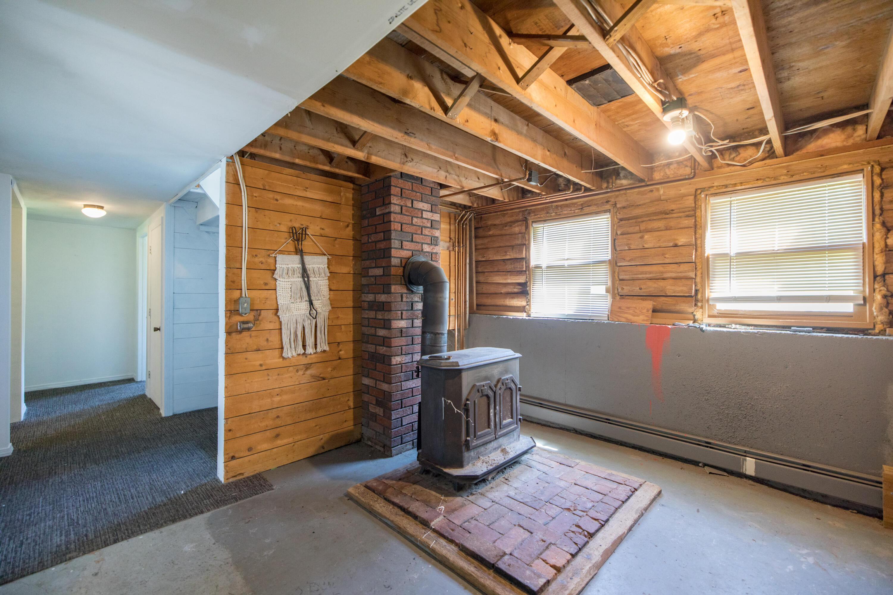 628 Norridgewock Road Fairfield, ME 04937 - Photo 37 of 47 Lower level wood stove