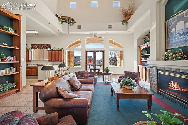 a living room with lots of furniture and white walls
