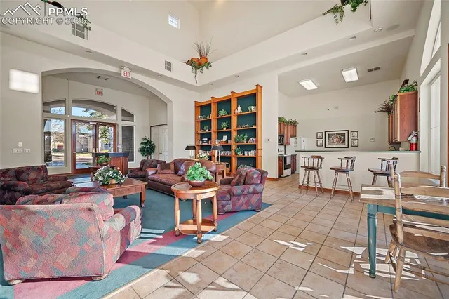 a kitchen with granite countertop a sink stove and cabinets