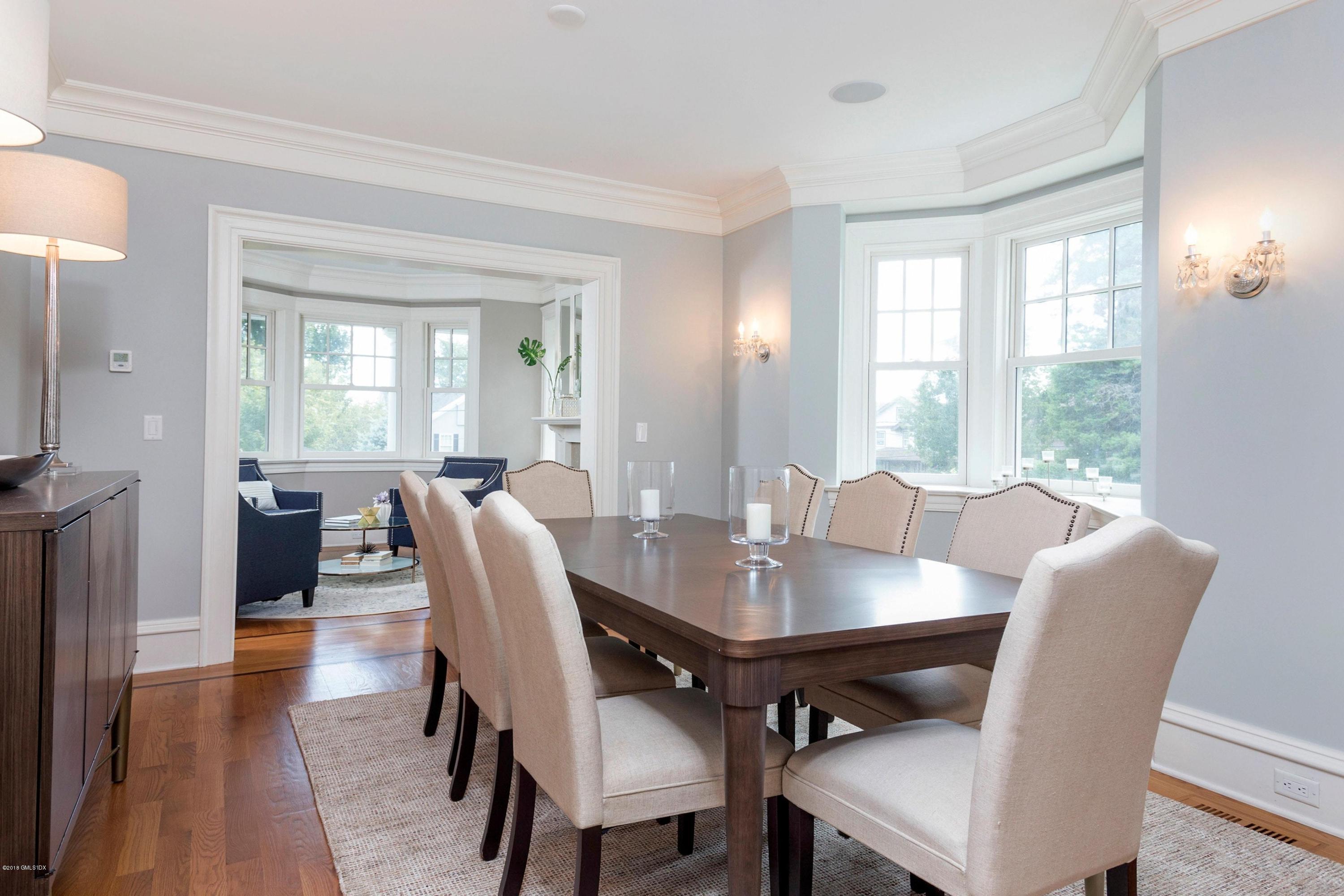 58 Ridge Street Greenwich, CT 06830 - Photo 12 of 29 a view of a dining room with furniture window and wooden floor