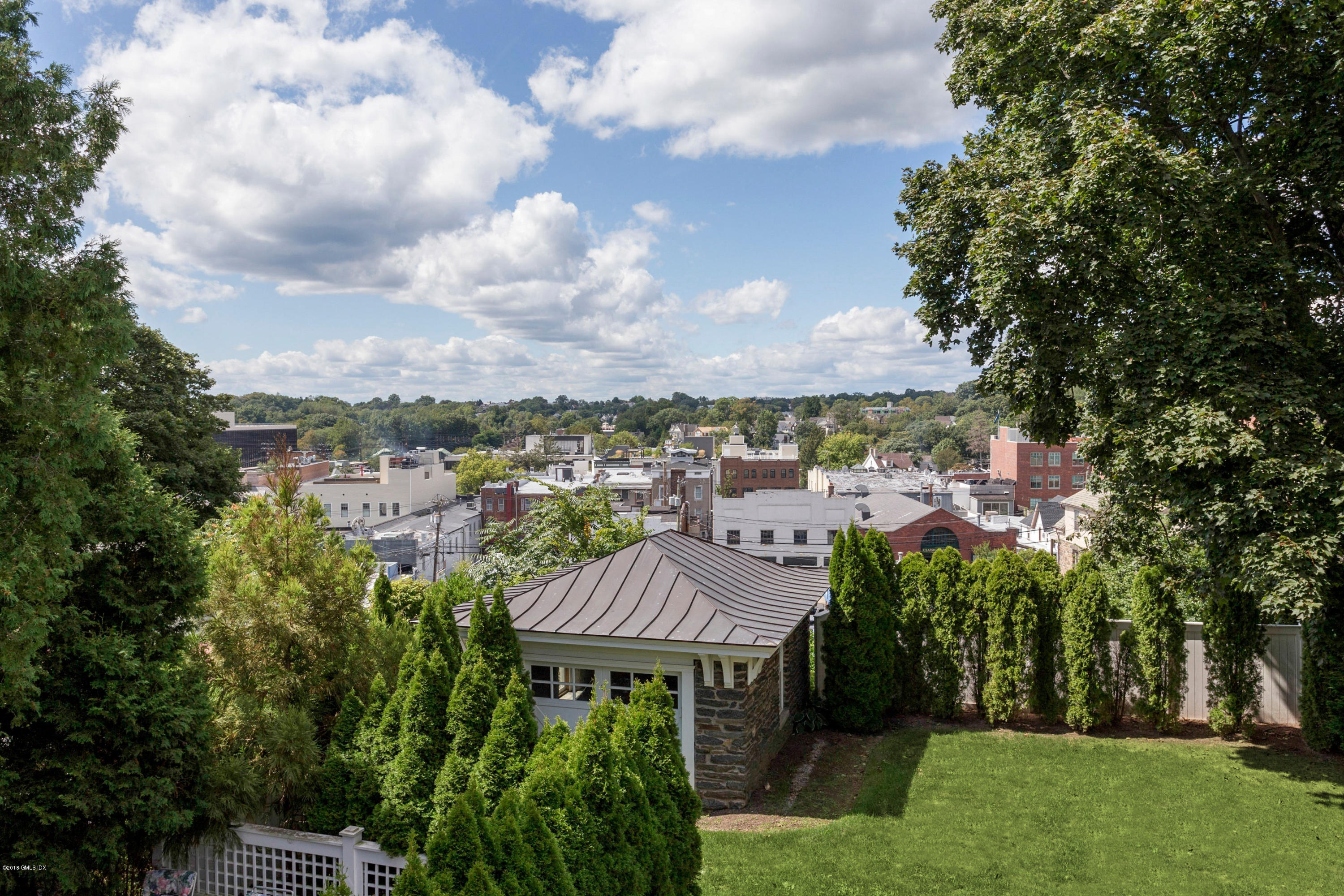 58 Ridge Street Greenwich, CT 06830 - Photo 26 of 29 a view of a city with lush green space