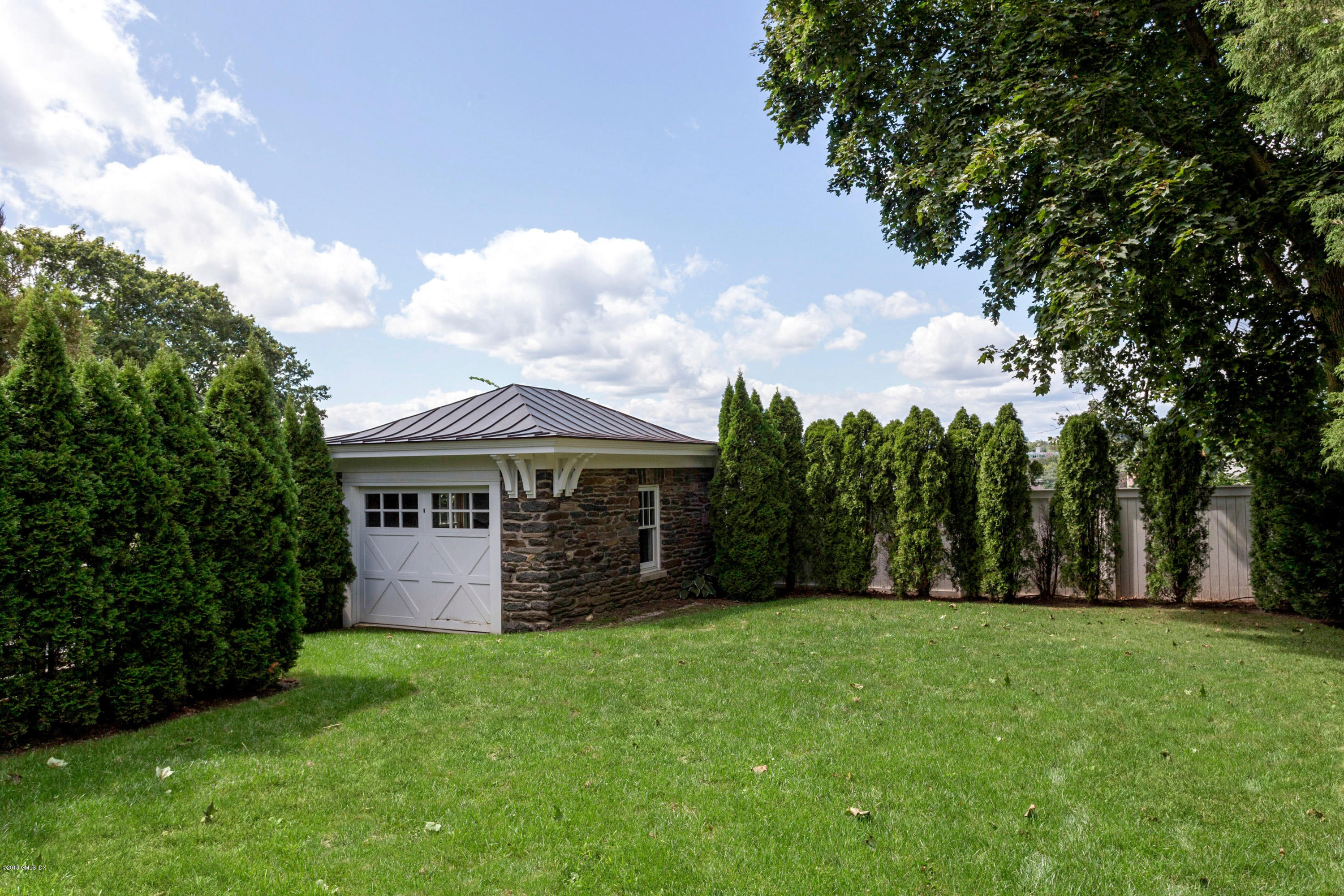 58 Ridge Street Greenwich, CT 06830 - Photo 28 of 29 a view of a house with a backyard