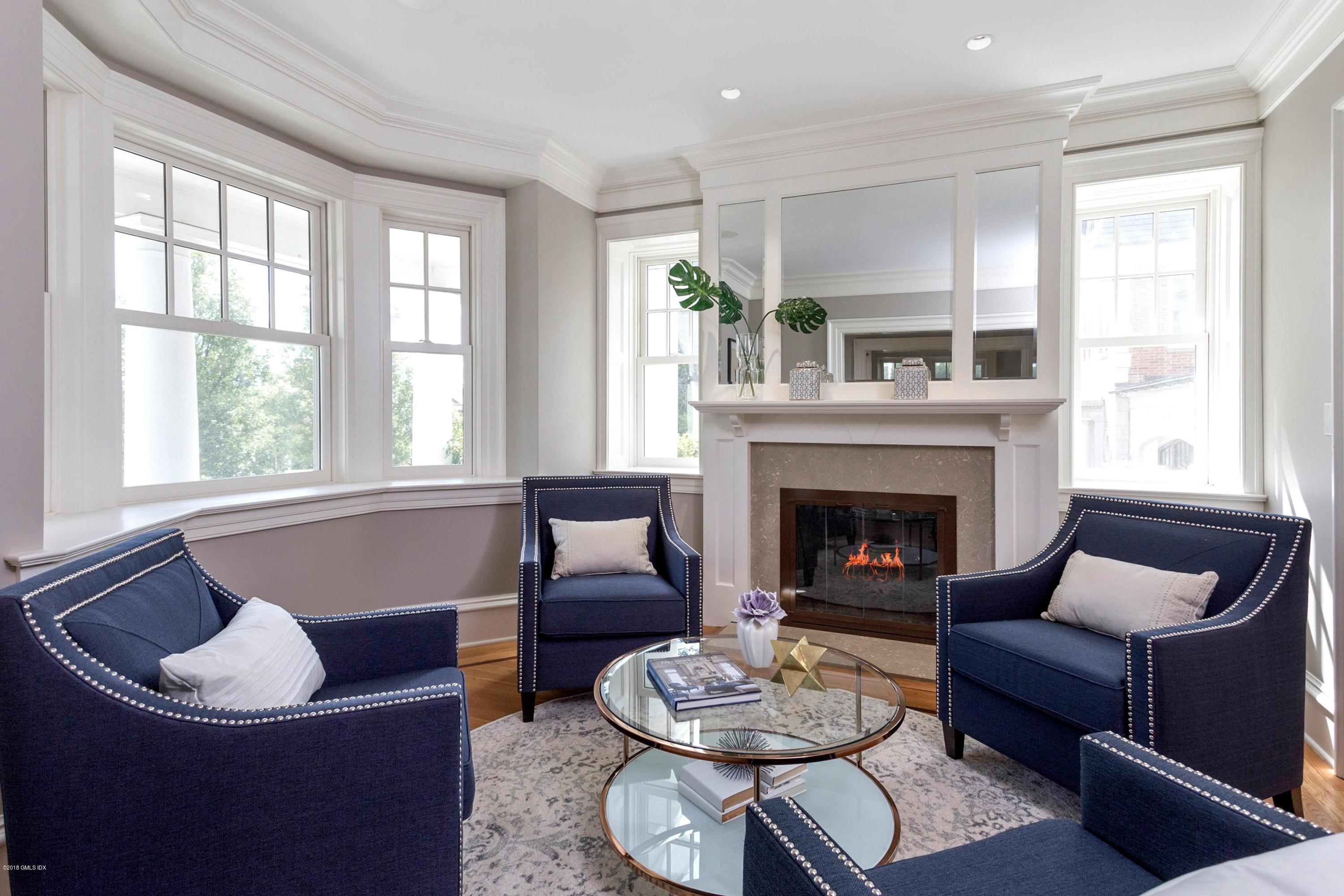 58 Ridge Street Greenwich, CT 06830 - Photo 6 of 29 a living room with furniture and a fireplace