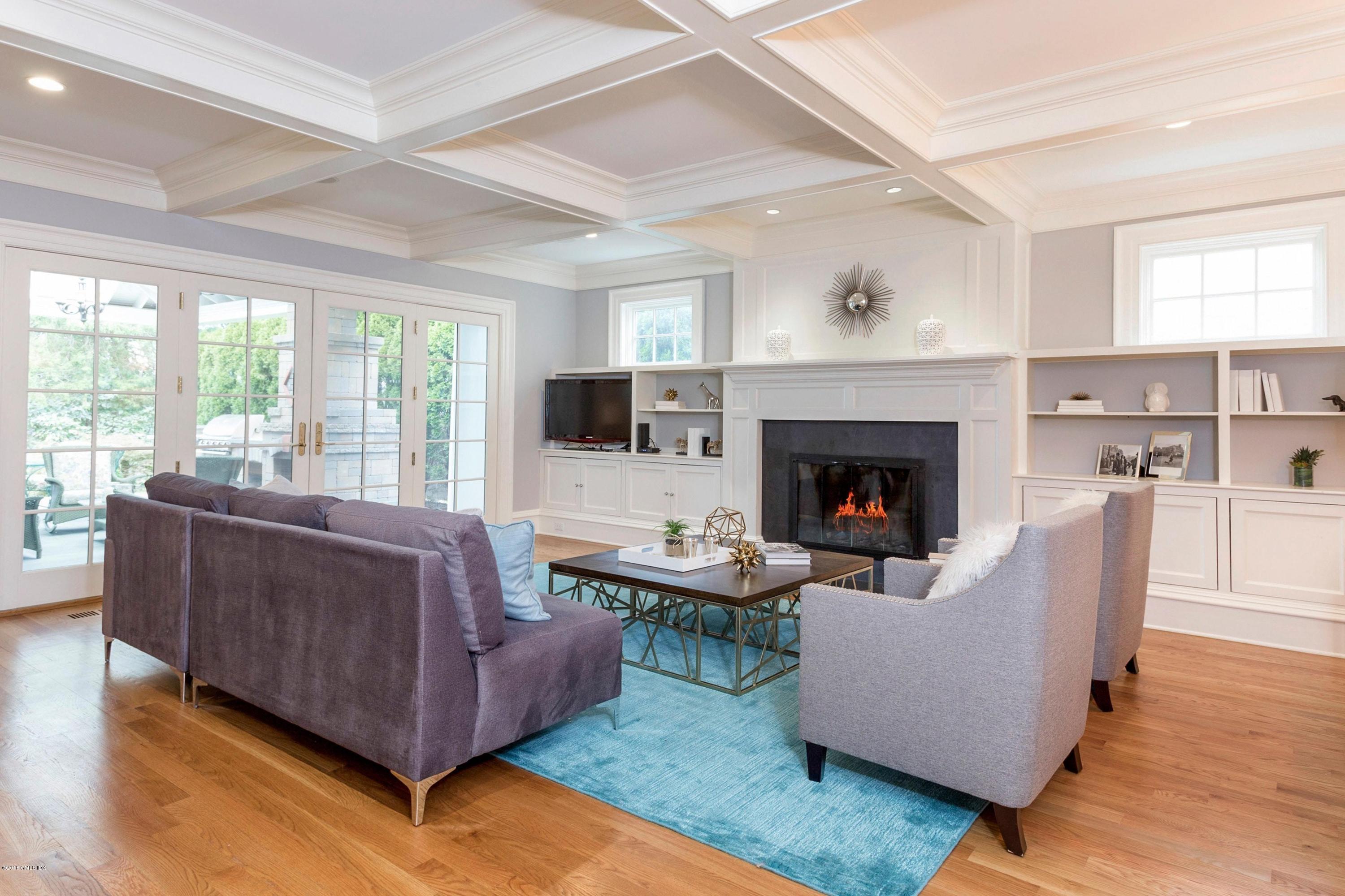 58 Ridge Street Greenwich, CT 06830 - Photo 8 of 29 a living room with furniture and a fireplace