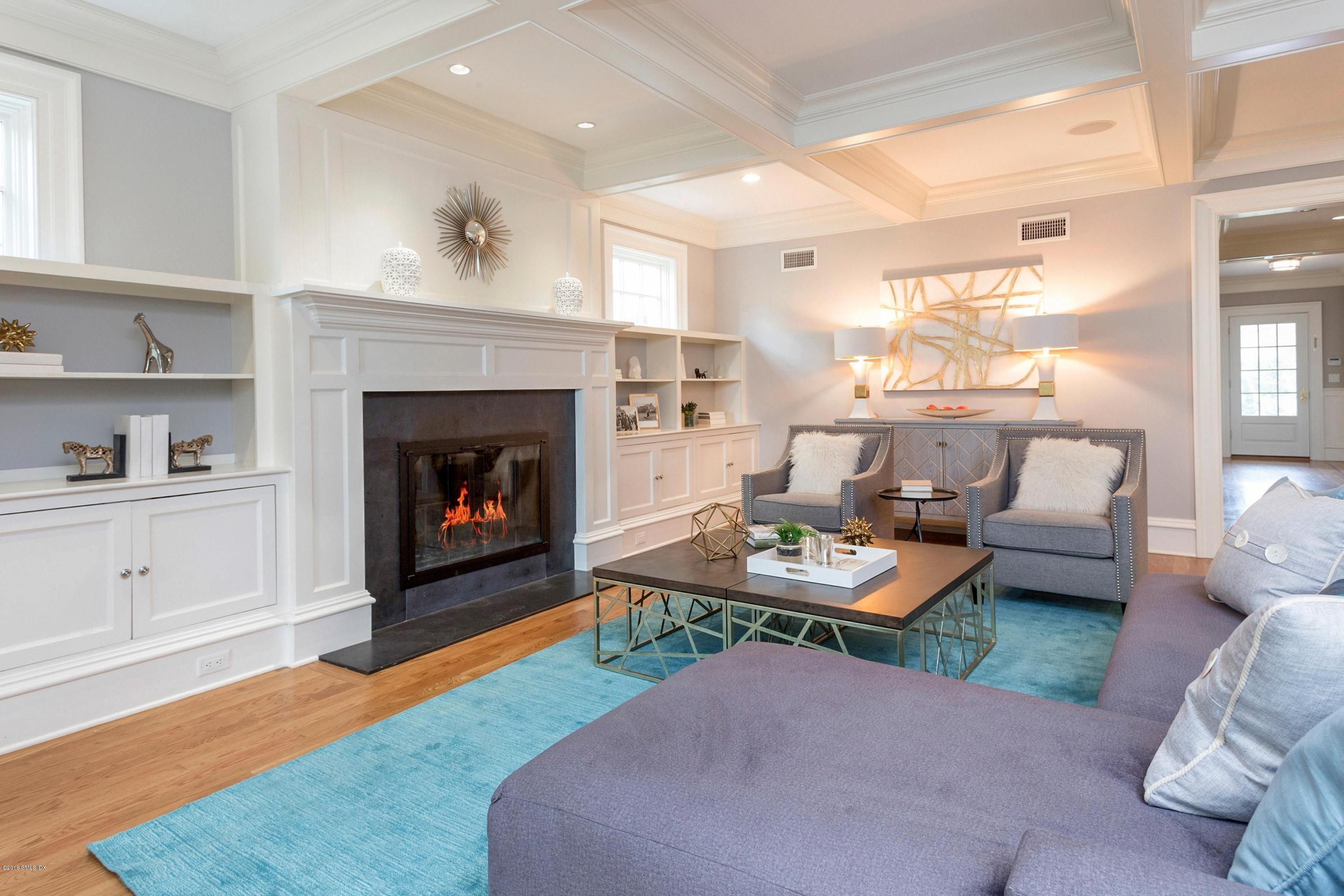 58 Ridge Street Greenwich, CT 06830 - Photo 9 of 29 a living room with furniture and a fireplace