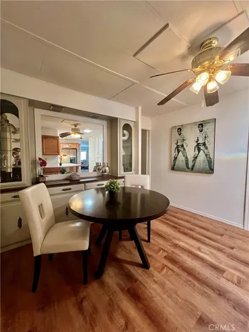 a living room with furniture a rug and a chandelier