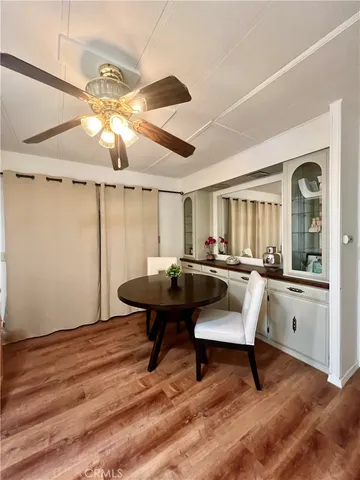 a living room with furniture a rug and a chandelier