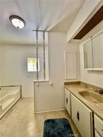 a utility room with cabinets washer and dryer