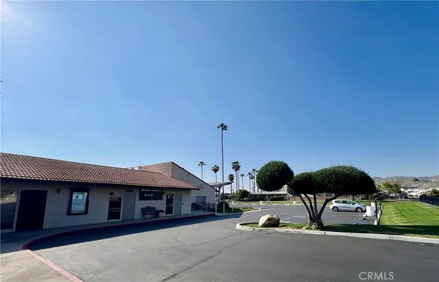 a view of a backyard with a garden and entertaining space