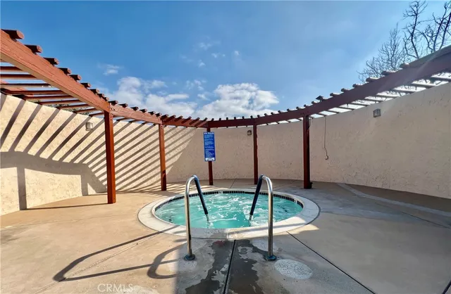 a view of a room with lots of furniture and wooden floor