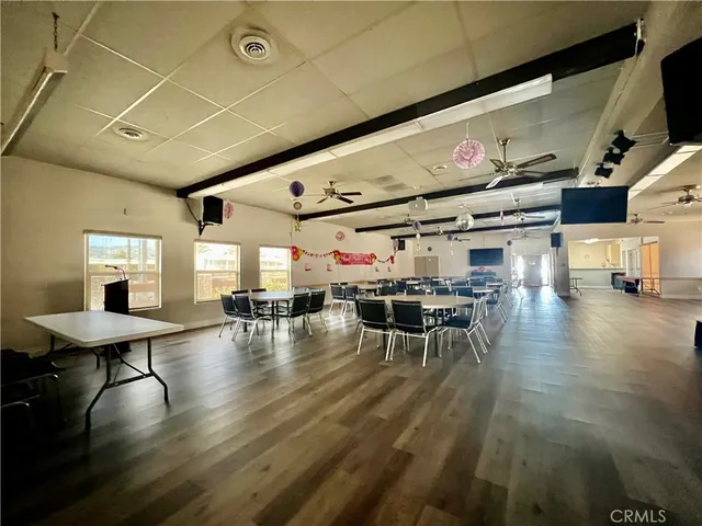 a yard with lots of trees and buildings