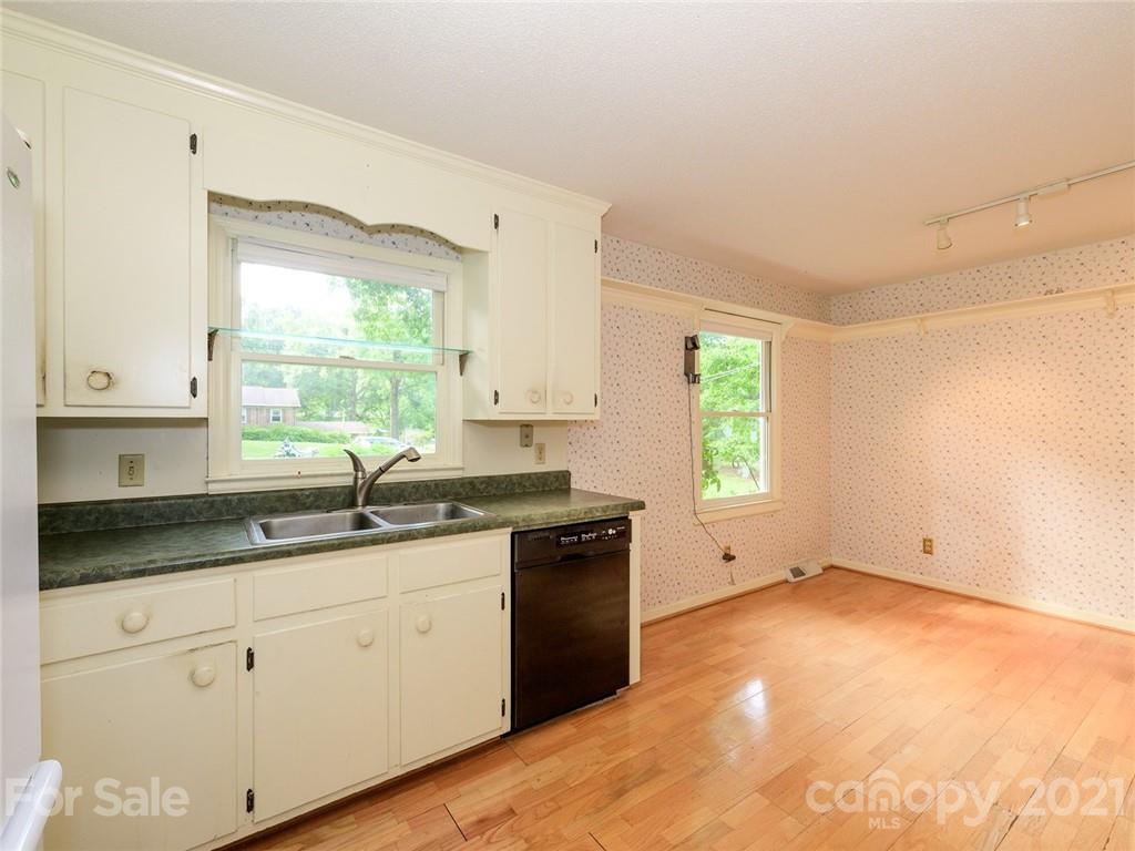 857 Pinebranch Road Rock Hill, SC 29730 - Photo 16 of 30 a kitchen with granite countertop white cabinets white appliances with a sink and dishwasher