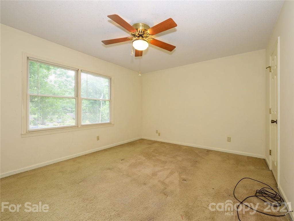 857 Pinebranch Road Rock Hill, SC 29730 - Photo 23 of 30 an empty room with ceiling fan and window