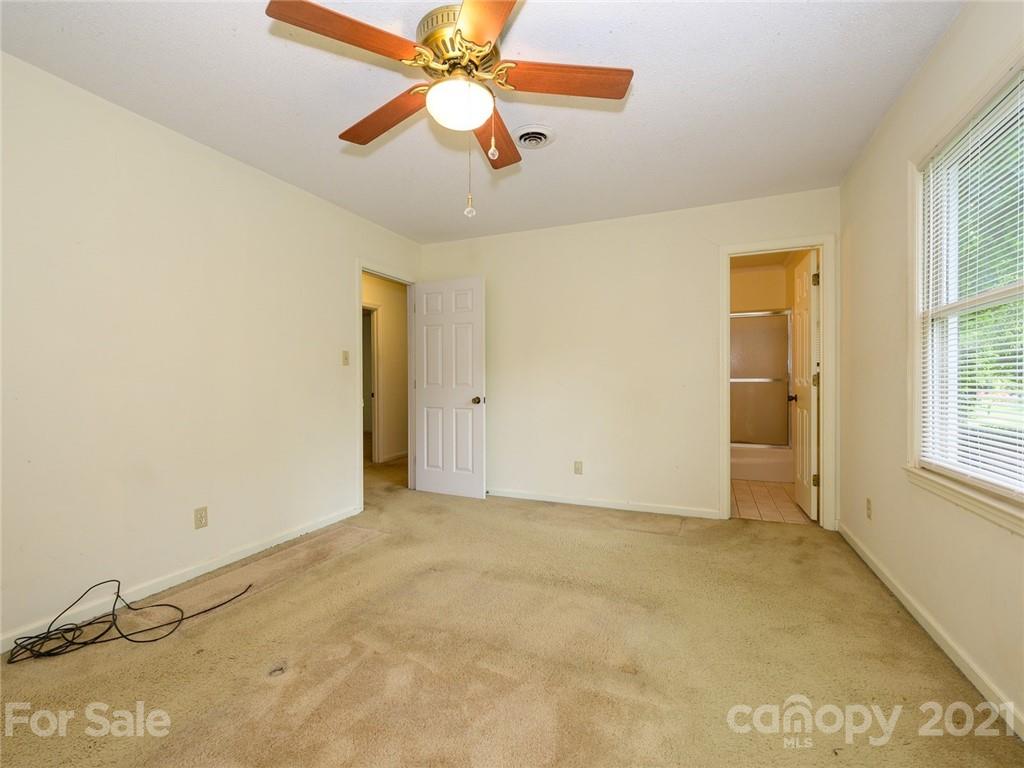 857 Pinebranch Road Rock Hill, SC 29730 - Photo 24 of 30 an empty room with closet and a chandelier fan