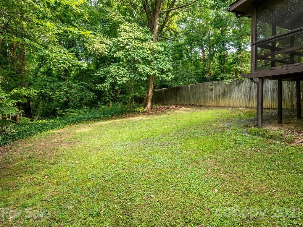 857 Pinebranch Road Rock Hill, SC 29730 - Photo 28 of 30 a backyard of a house with lots of plants and large tree