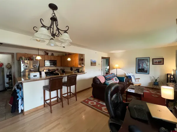 a living room with furniture and a table