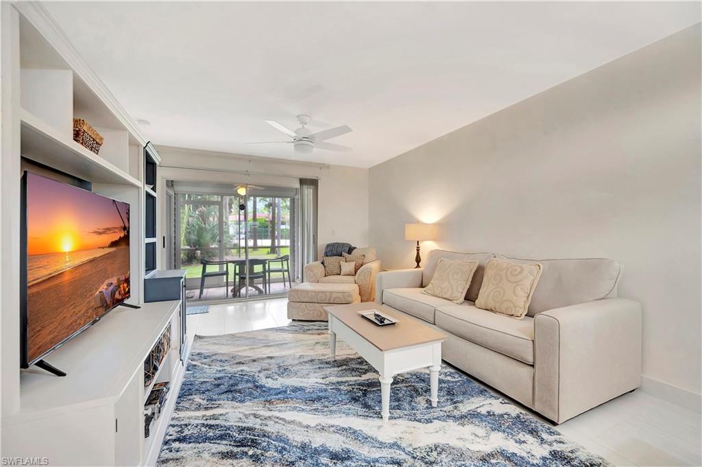 1925 Courtyard Way, Unit F101 Naples, FL 34112 - Photo 2 of 20 Living Area and Screened Porch