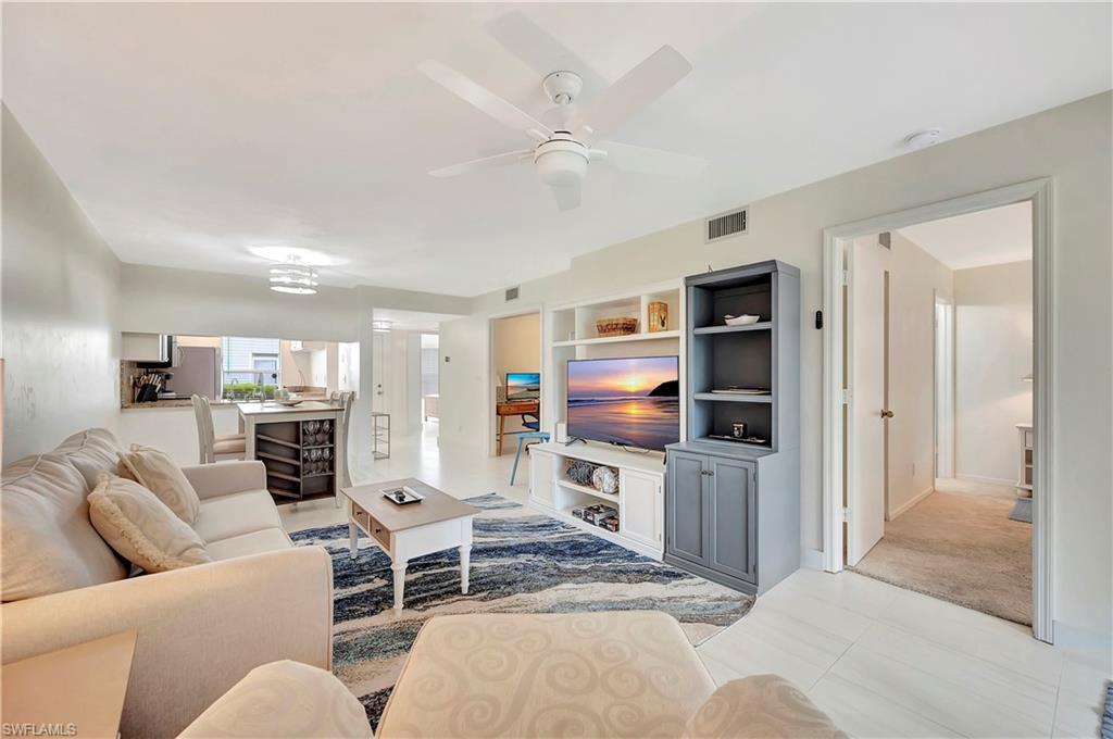 1925 Courtyard Way, Unit F101 Naples, FL 34112 - Photo 4 of 20 Living Area and Primary Bedroom entrance