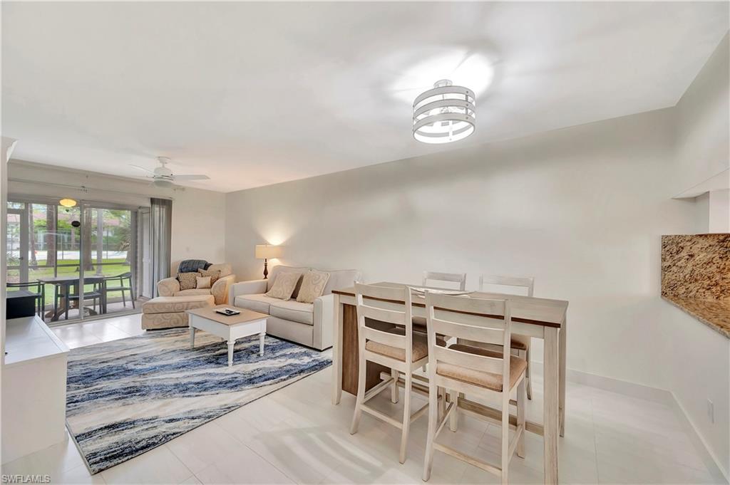 1925 Courtyard Way, Unit F101 Naples, FL 34112 - Photo 5 of 20 Living / Dining Area