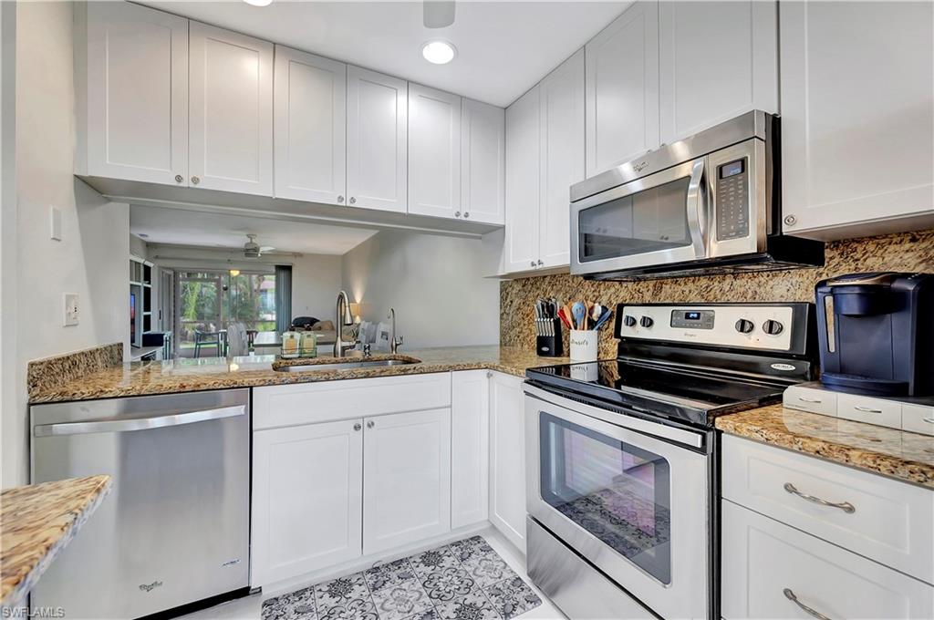 1925 Courtyard Way, Unit F101 Naples, FL 34112 - Photo 7 of 20 Kitchen with pass-throug