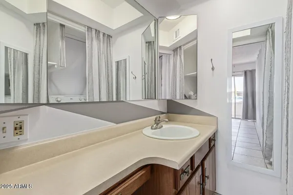 a bathroom with a sink and a mirror