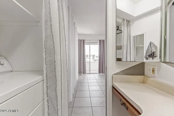 a kitchen with a sink and a refrigerator