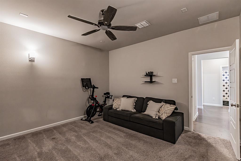 10269 Hanks Creek Road Fort Worth, TX 76126 - Photo 13 of 40 a living room with furniture and a ceiling fan