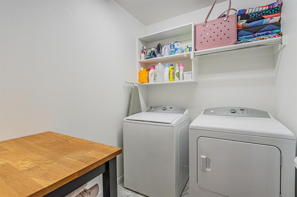 10269 Hanks Creek Road Fort Worth, TX 76126 - Photo 14 of 40 a utility room with dryer and washer