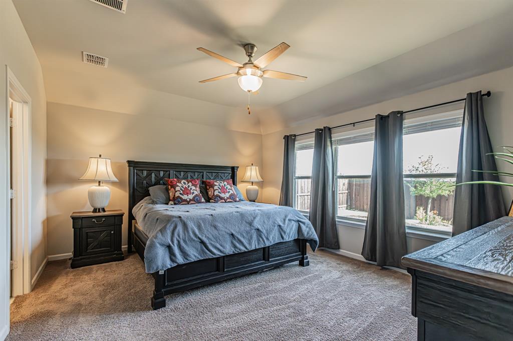 10269 Hanks Creek Road Fort Worth, TX 76126 - Photo 16 of 40 a bedroom with a bed and a table